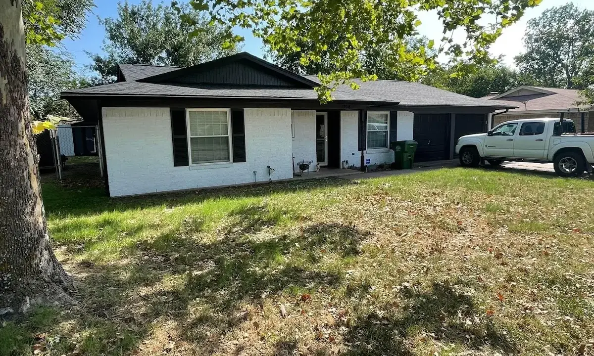 Professional roofing crew working on a residential roof in Appleton